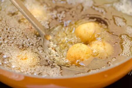 preparation of meatballs in a frying panの写真素材