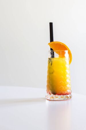 Tequila sunrise cocktail on a gray background, verticalの写真素材