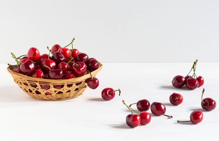 Sweet fresh cherries in a bowl isolated on white backdrop, fruit backround. Healthy food, vegetarianの写真素材