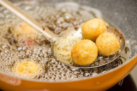 preparation of meatballs in a frying pan at home