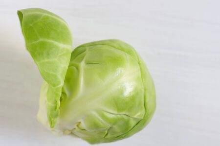 Close up of fresh raw brussels sprouts isolated on white background top viewの写真素材