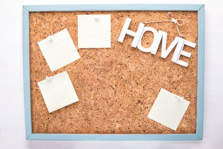 homework planning on cork board, four stickers or letterheads on a corkboard, a notification...