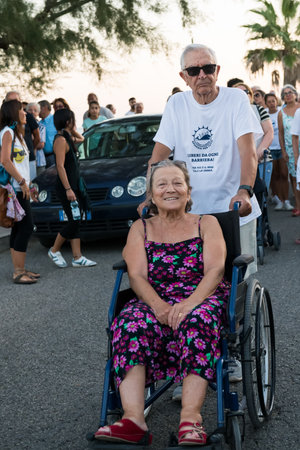TORRE COLIMENA, ITALY - 1 August 2019, Protest against the discharge of the purifier to the Ionian sea. A disabled and elderly lady protests against being discharged to the sea, Salento, Pugliaのeditorial素材