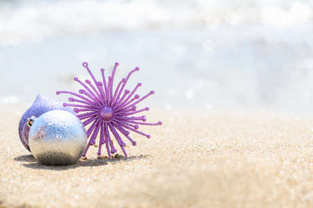 Christmas glitter pink decoration star on the tropical beach near ocean