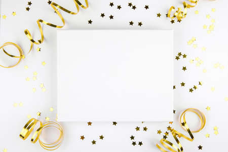 Christmas canva mockup with golden festive decoration ribbon, stars on a white background. Design element for Christmas and New Year congratulation, thank you, greeting or invitation card, art workの写真素材