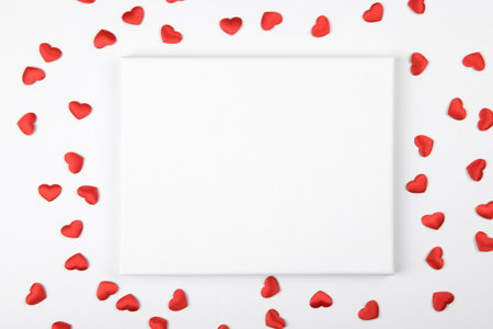 Valentines Day canvas mockup with red hearts decoration on a white backgroundの写真素材