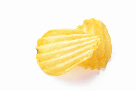 Potato chips close-up on white background.の写真素材