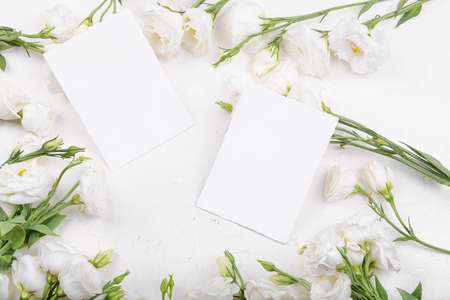Two empty card mockup with blooming white eustoma lisianthus flowers
