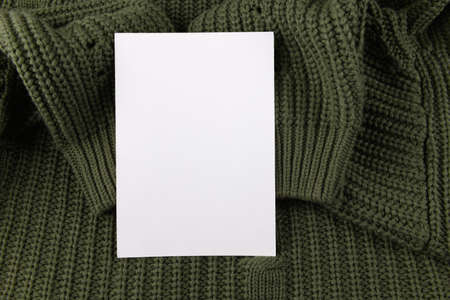card mockup with grenr knitted background with copy place with garlandの写真素材