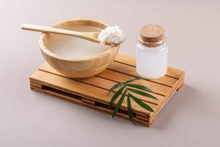 Homemade cosmetic rice water with ingredients and beauty kit on beige background, healthy beauty treatment ingredients for homemade comsetics, beauty recipe for home spa, natural skincare preparationの写真素材