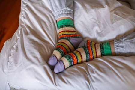 Close-up of women's feet in warm colored socksの写真素材