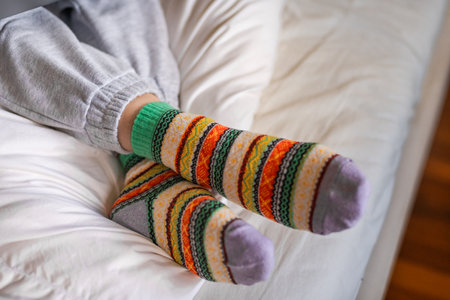 Close-up of women's feet in warm colored socksの写真素材