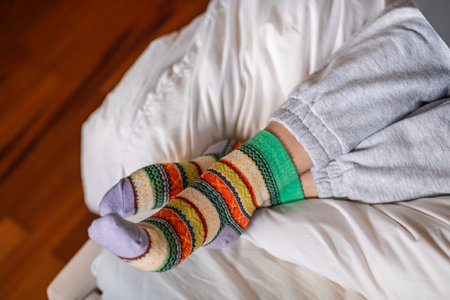 Close-up of women's feet in warm colored socksの写真素材