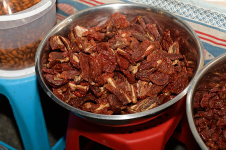 Dried Tomatoes on Display at a Local Market During Evening Hoursの写真素材