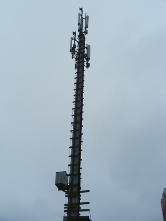 Mast of cellular communication with microwave radio antenna equipment in Belarus