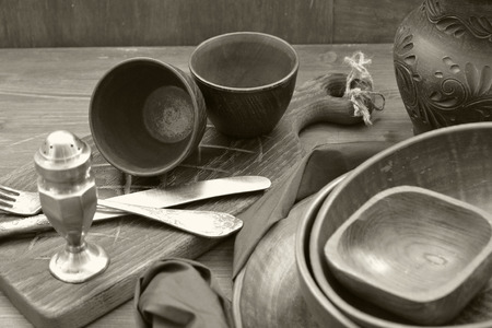 monochrome photo of rustic pottery and home interior decor. Antique crockeryの写真素材