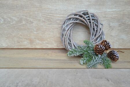 Christmas wreath decoration with pine cone, tree branch. Copy spaceの写真素材