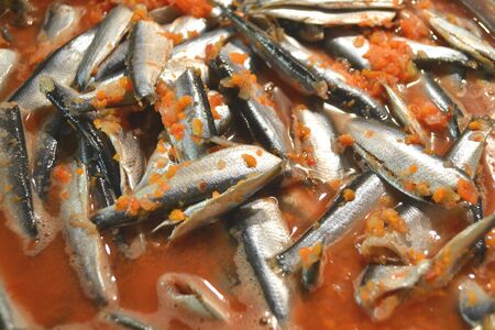 Russian cuisine: top view of conserved salade texture, sardine or mackerel in tomato sauce, fish sprats.の写真素材