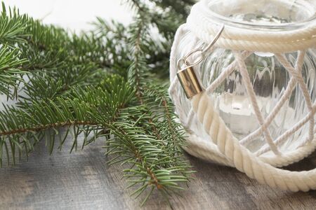 Candlesticks and Christmas tree branches. Christmas conceptual rustic backgroundの写真素材