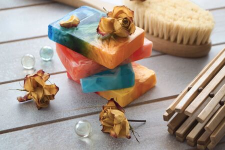 Organic handmade soap. Colorful soap with dry rose flowerの写真素材
