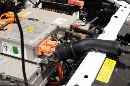 MINSK, BELARUS - 18 JUIN 2022 - an electrocar with a charging cord, connecting it to a charger, electric vehicle service for renault close upのeditorial素材