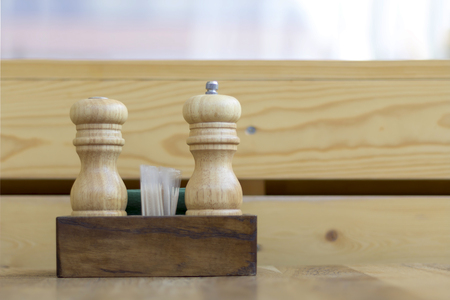 Wooden salt and pepper shakers, toothpick on the wood tableの写真素材