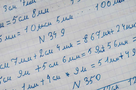 Exercise book of a student with numbers and examplesの写真素材