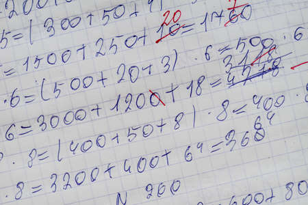 Exercise book of a student with numbers and examplesの写真素材