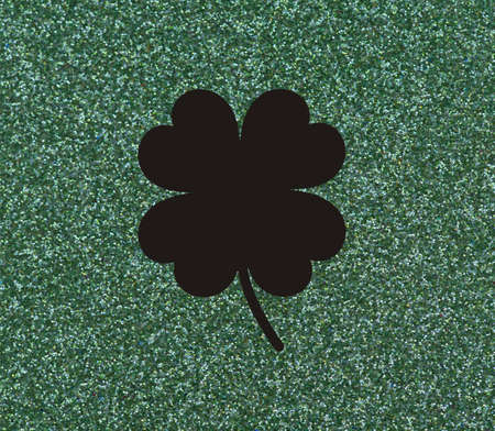 Clover with four leaves Black on a glittery green background.