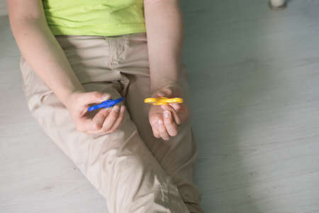 Man playing with spiners. Top view Stock photo.の写真素材