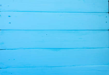 Wooden background. Texture, the surface of the old boards from natural wood with different shades of bright blue, aquamarine, turquoise color. The top view. Close-up. The stock photos.の写真素材