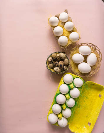 White chicken Chicken and quail eggs in colored paper eco-friendly packaging with decorative sisal.