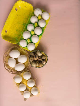 White chicken Chicken and quail eggs in colored paper eco-friendly packaging with decorative sisal.