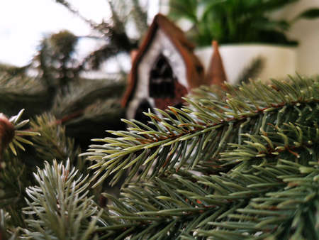 Christmas candlestick, stylized as an old half-timbered German house among spruce branches. Christmas theme. New Yaer cardの写真素材