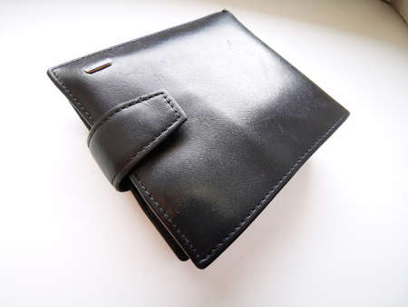 Black leather men's wallet with many pockets and compartments for credit and discount cards....