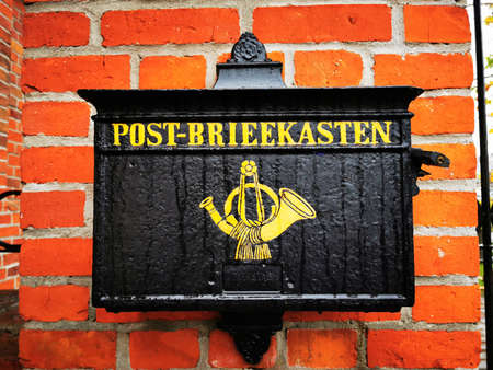 Black mailbox. Old white brick wall. Vintage natural pattern. Red brick wall texture grunge...