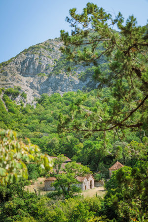 Ancient Armazi Monastery hidden in lush green forest near Mtskheta, Georgia. Peaceful spiritual retreat nestled in nature. Ideal for travel, history, editorial, and religious tourism themesの写真素材