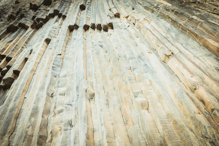 Dramatic wall of basalt columns in Garni Gorge, Armenia. Unique volcanic rock formation with natural...