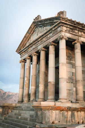 Detailed close-up of the front columns and pediment of the Temple of Garni in Armenia, showing the ancient carvings and architectural beautyの写真素材