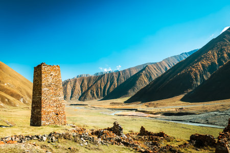 Ancient stone ruins of an abandoned Ossetian village in the scenic Truso Valley, Georgia. Autumn...