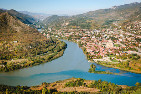 Aerial view of Mtskheta, Georgia, with confluence of rivers Aragvi and Kura, traditional red-roof...