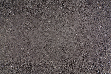 A smooth dark grey asphalt pavement texture.の写真素材