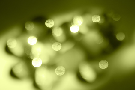 Green abstract background with blurred lights. Color of Spring and Summer 2019.
