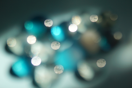 Bright blue and white abstract background with blurred lights.の写真素材