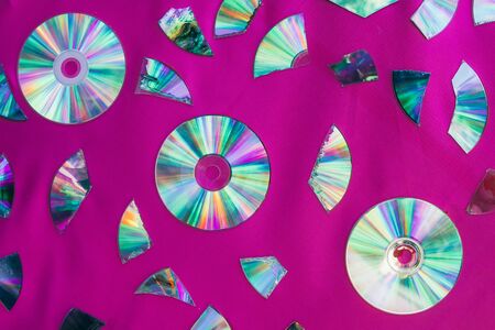 Vintage CD or DVD disk background, old circle discs and treir parts used for data storage, share...