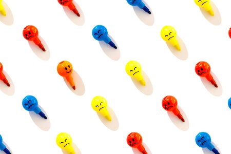 Pattern of emotions balls background. Blue, yellow and red balls are sad and crying, and orange ball is happy.の写真素材