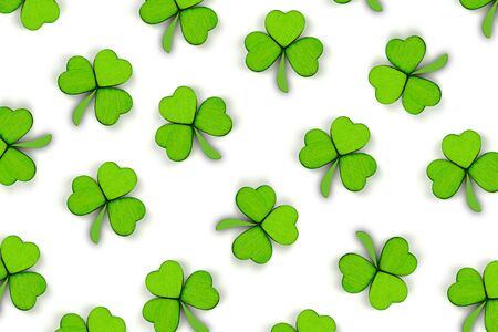 Pattern of green clovers or shamrocks isolated on white background. St. Patrick's Day Holiday concept. Spring background.の写真素材