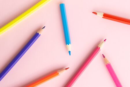 Background image of colorful pencils. Pencils on pink background. Back to school, education and learning concept. Minimalist isometric concept.の写真素材