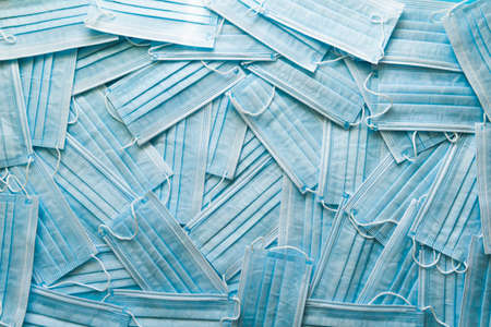 Background of a lot of medical masks. Concept of 2020 and protection from flu and virus, coronavirus.の写真素材