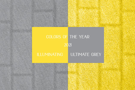 Yellow grass background with a brick wall texture. Trendy colors of year 2021.